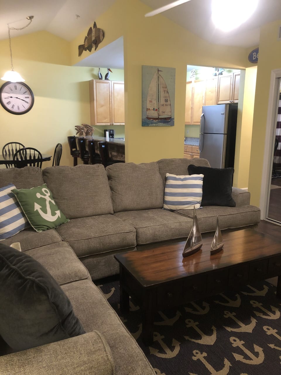 Living room view showing the dining and kitchen area.