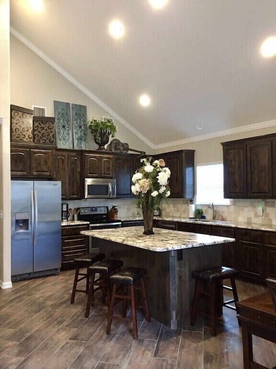 Kitchen includes gorgeous cabinetry and granite countertops  w/ oversized island