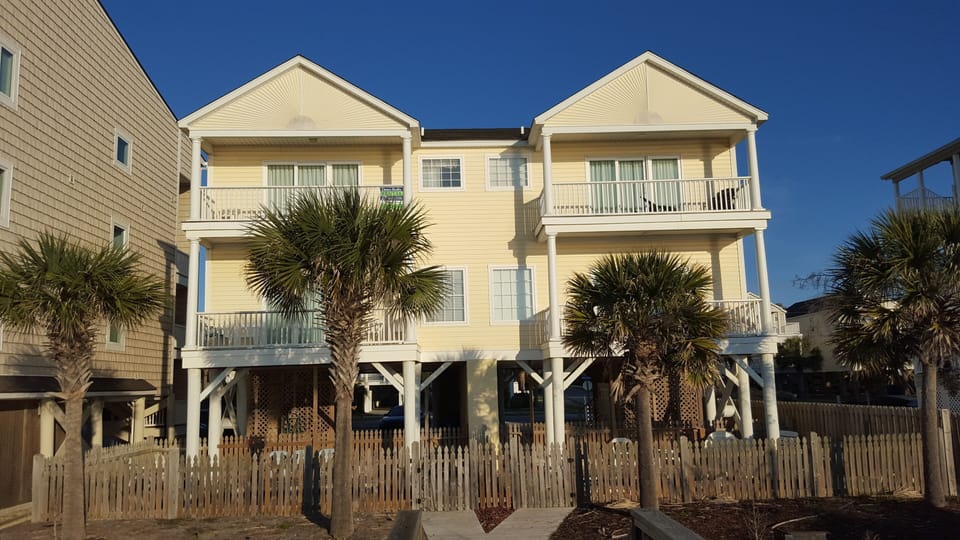 View from the beach to your townhome. LowTide is the one on the left