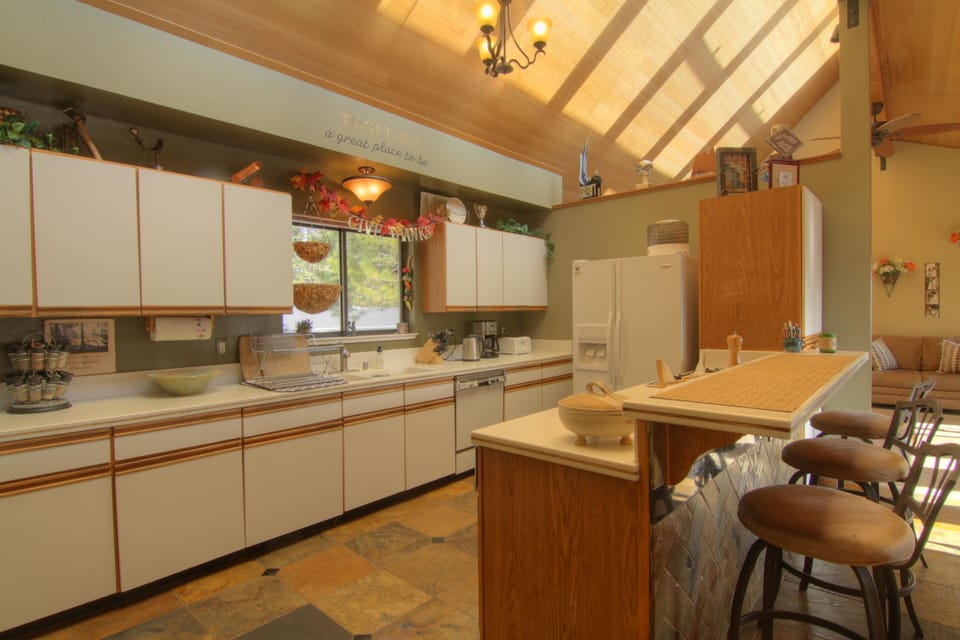 Kitchen with lots of counter space and as you can tell great sun light!