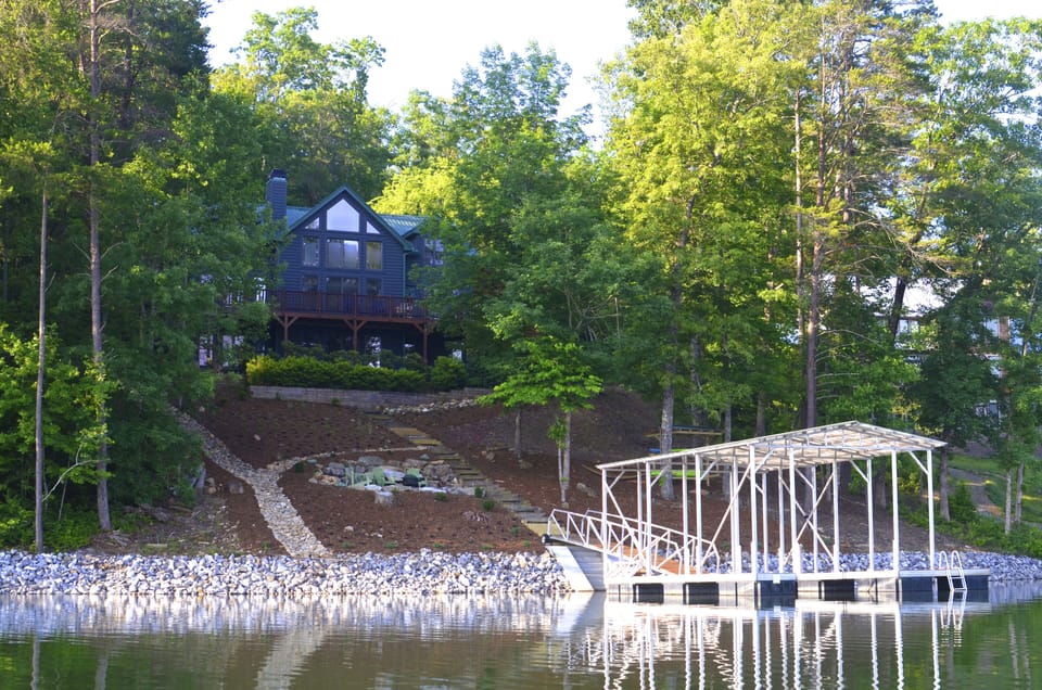 View From the water of dock, firepit and kayak rack