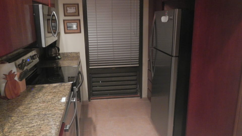 Kitchen Stainless steel Microwave, range, dishwasher and frig