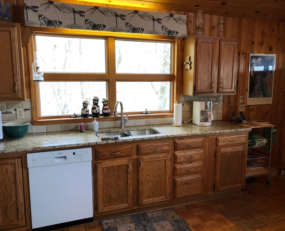 Newly updated granite counters, sink & cabinets.