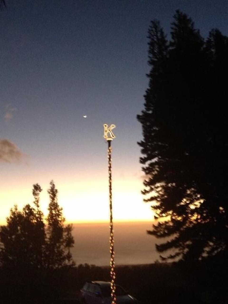 Our Flagpole at sunset in the middle of the driveway.