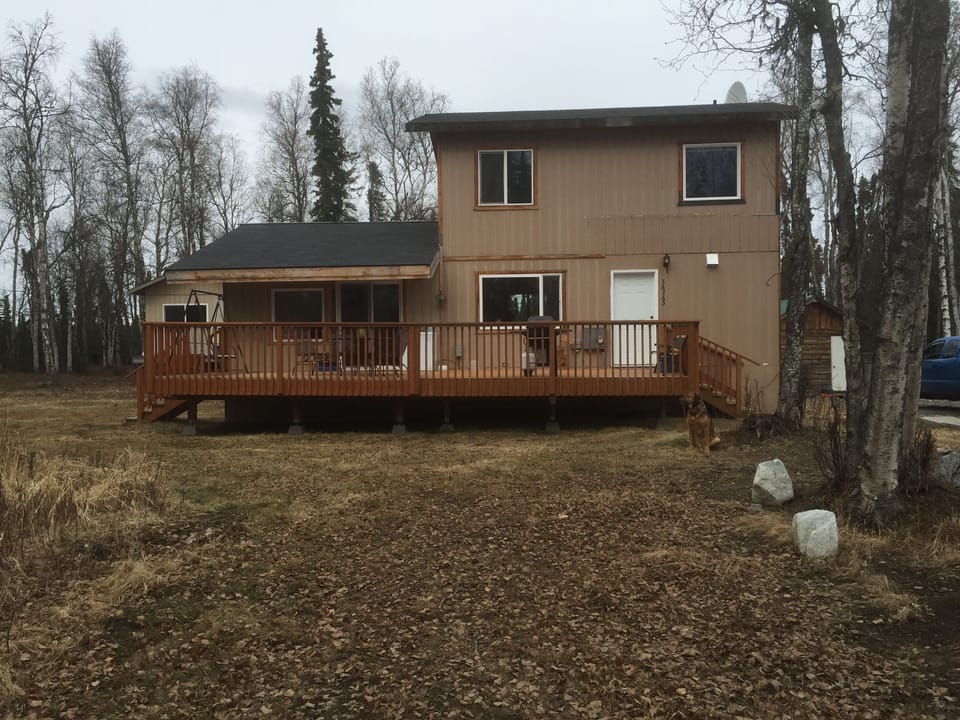 Front of house,  completed deck, grill, freezer, swing, table/chairs. Autumn 🍂