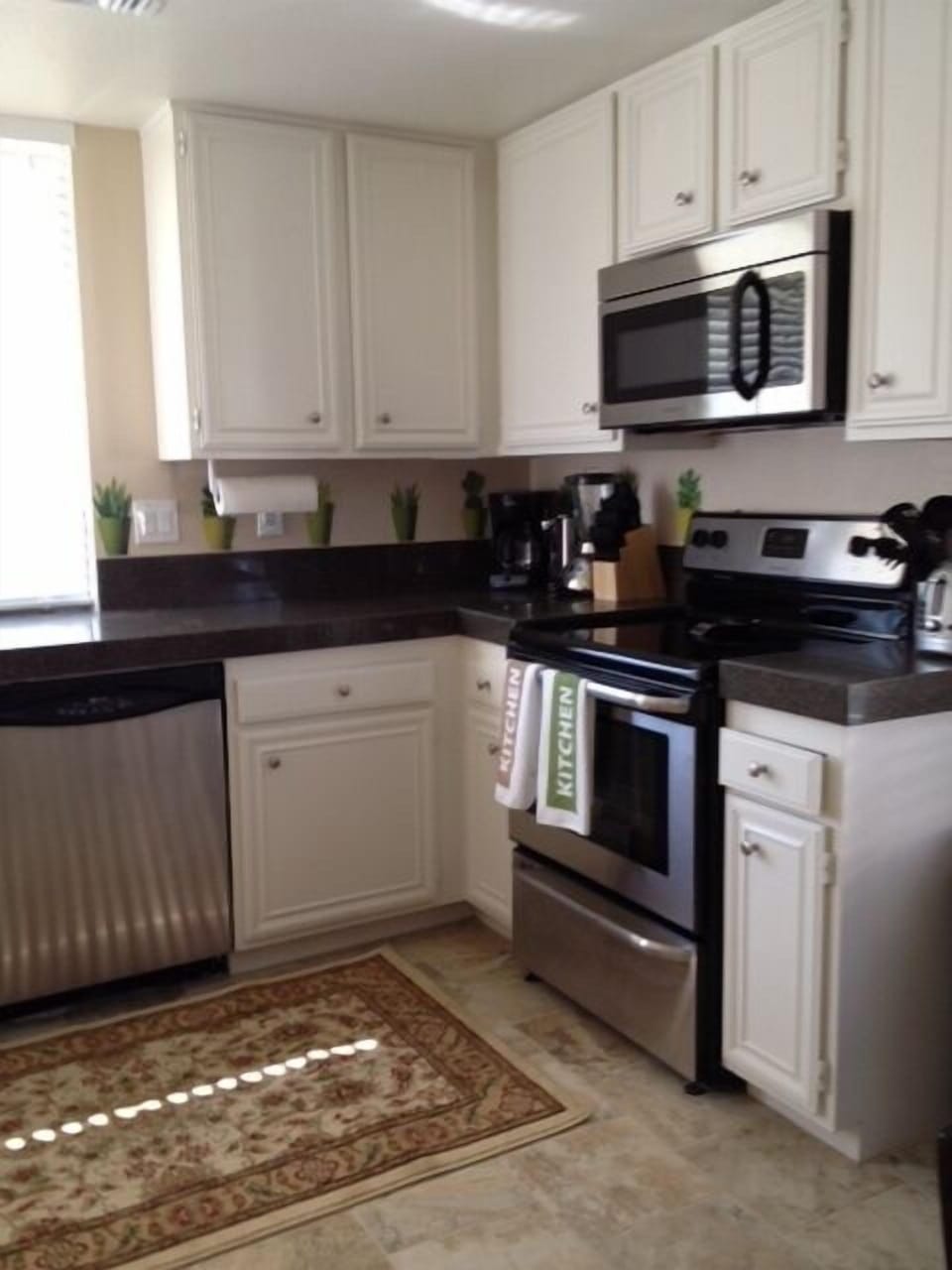 Updated kitchen with new stainless steal appliances & Keurig K-cup coffee maker.