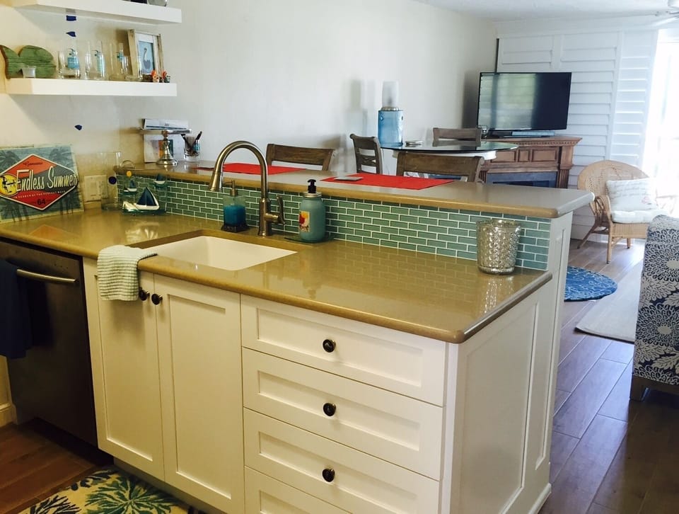 remodeled kitchen
quartz countertops
-glimpse of the fireplace under the TV
