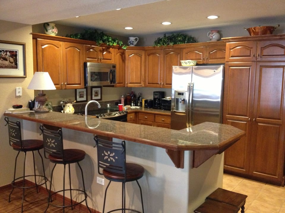 Kitchen with granite breakfast bar/counter and stainless appliances