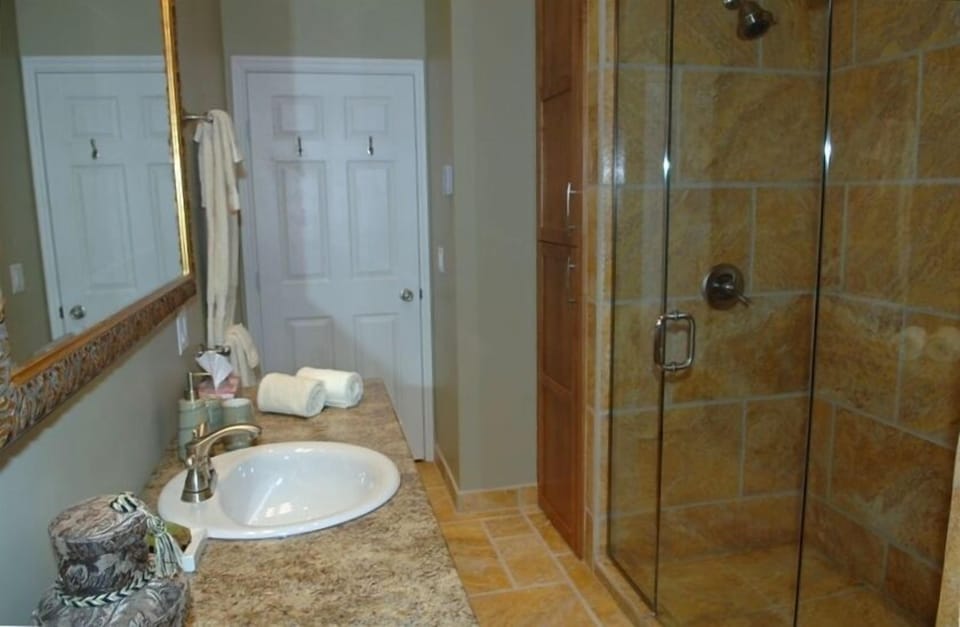 GORGEOUS BATHROOM WITH TRAVERTINE TILES AND OVERSIZE SHOWER