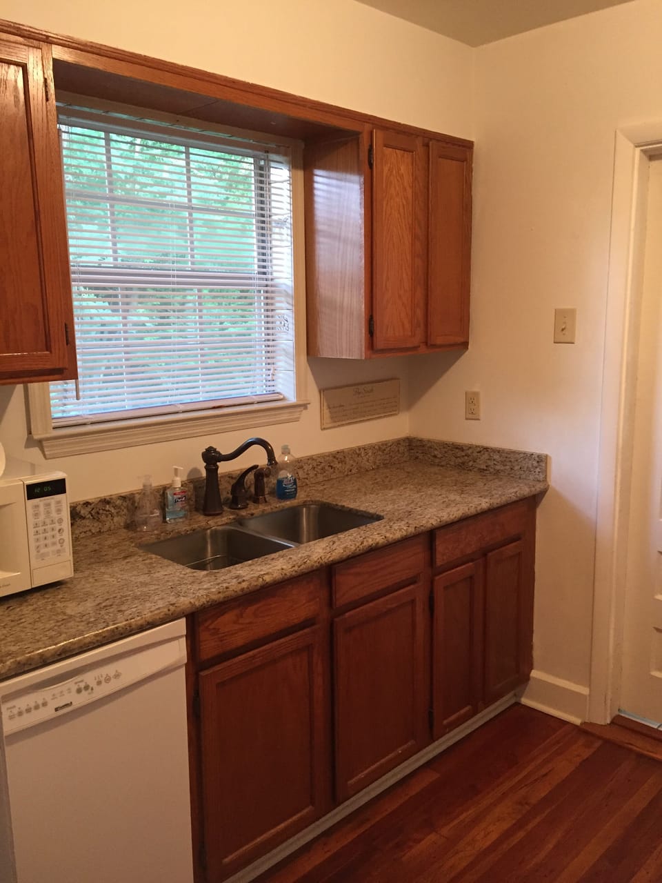 Galley kitchen, Granite countertop, under mount sink, and a great dishwasher.