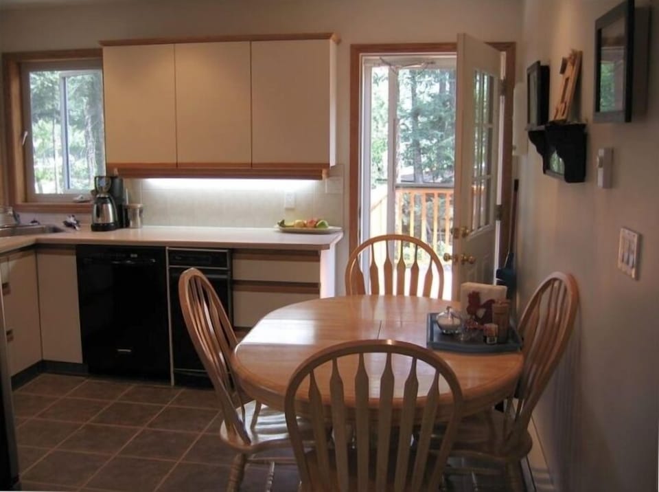 kitchen door to back deck. Eat in kitchen with all appliances and amenities