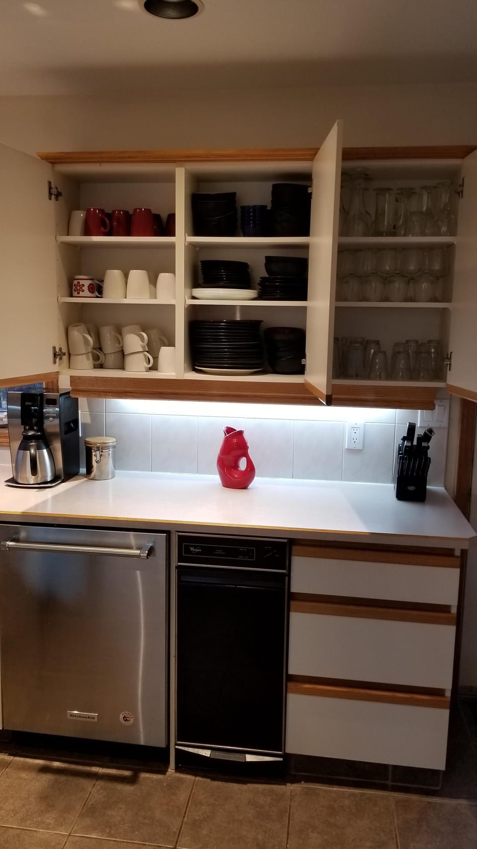 Fully stocked cupboards, dishes, glasses, pots/pans, serving dishes.