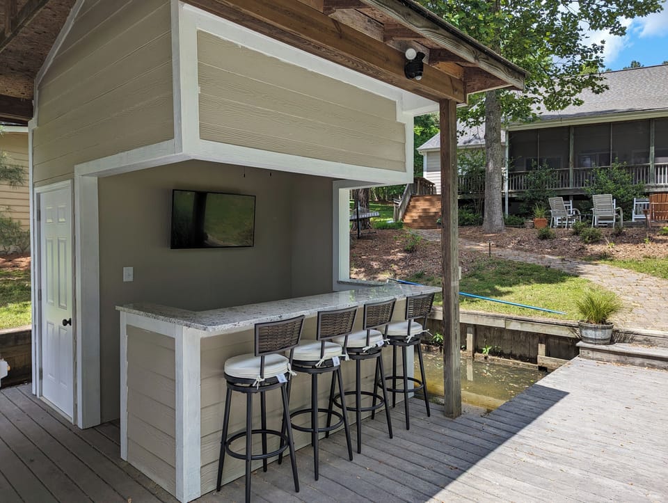 Enjoy the doc bar complete with fridge, TV and sound bar!