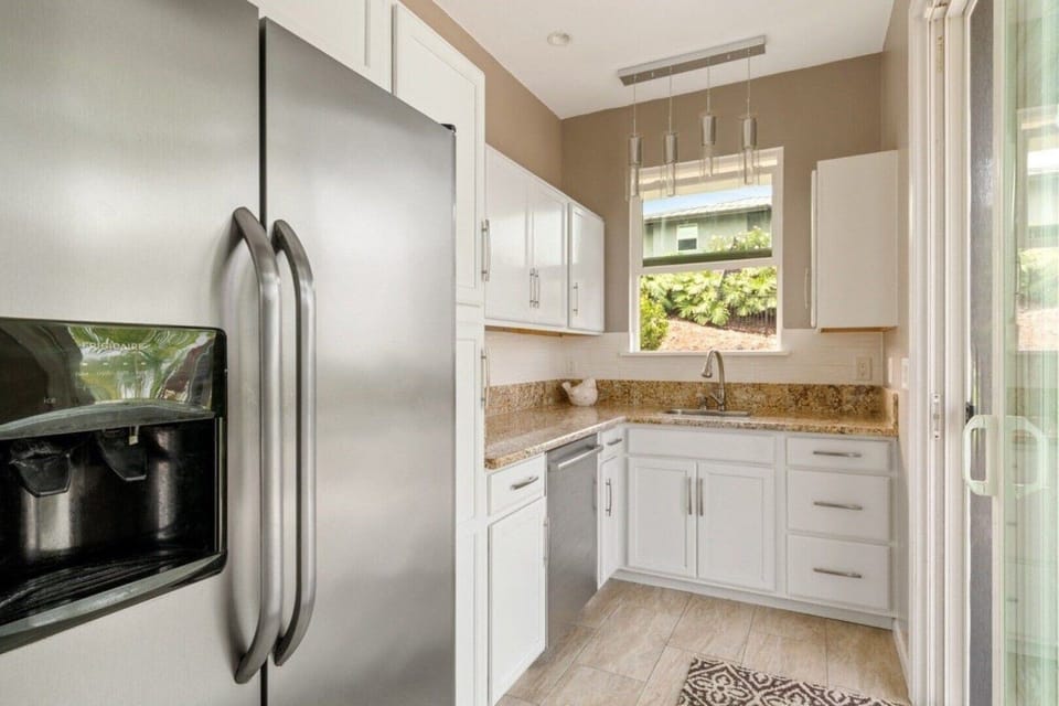 Full sized fridge and 2-burner stove in ohana kitchenette. 
