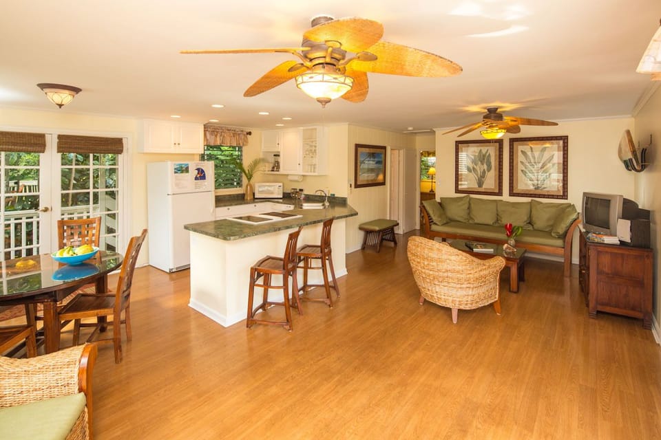 The living area has A/C, a flat screen TV, DVD/CD player, and comfy seating.