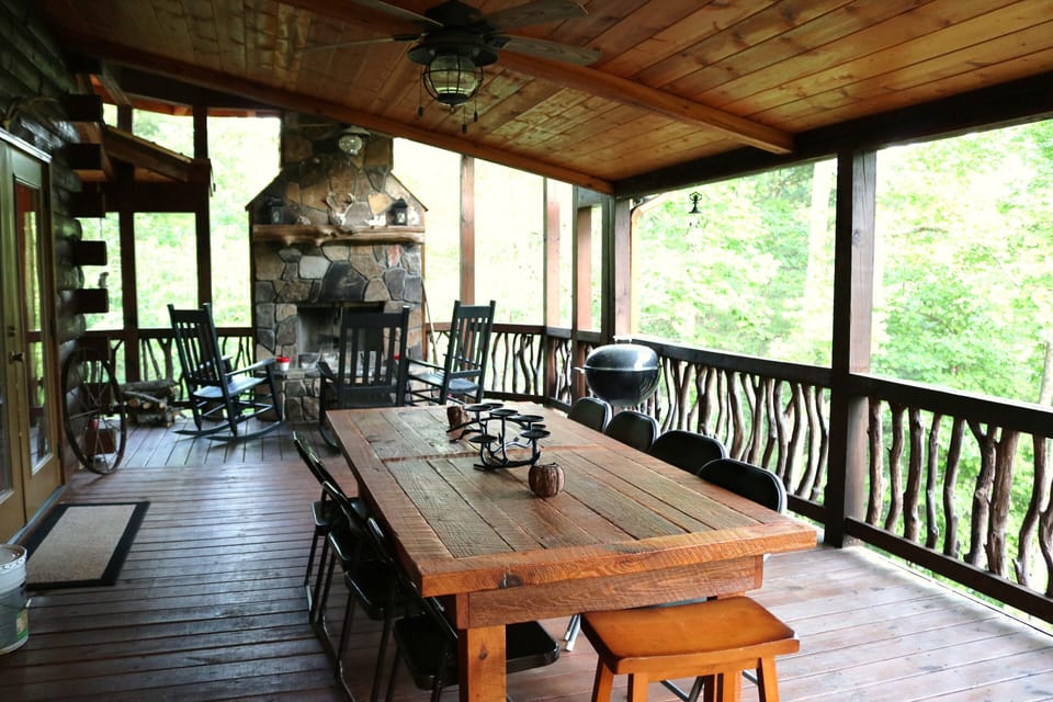 Main level back deck, w/ barnwood table & benches (not shown), woodburning F/P.