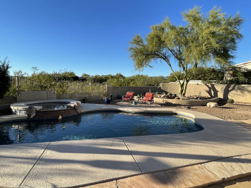 PebbleTec pool with hot tub waterfall