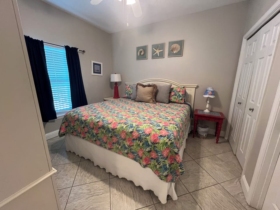 Guest bedroom with king bed and view of the lagoon