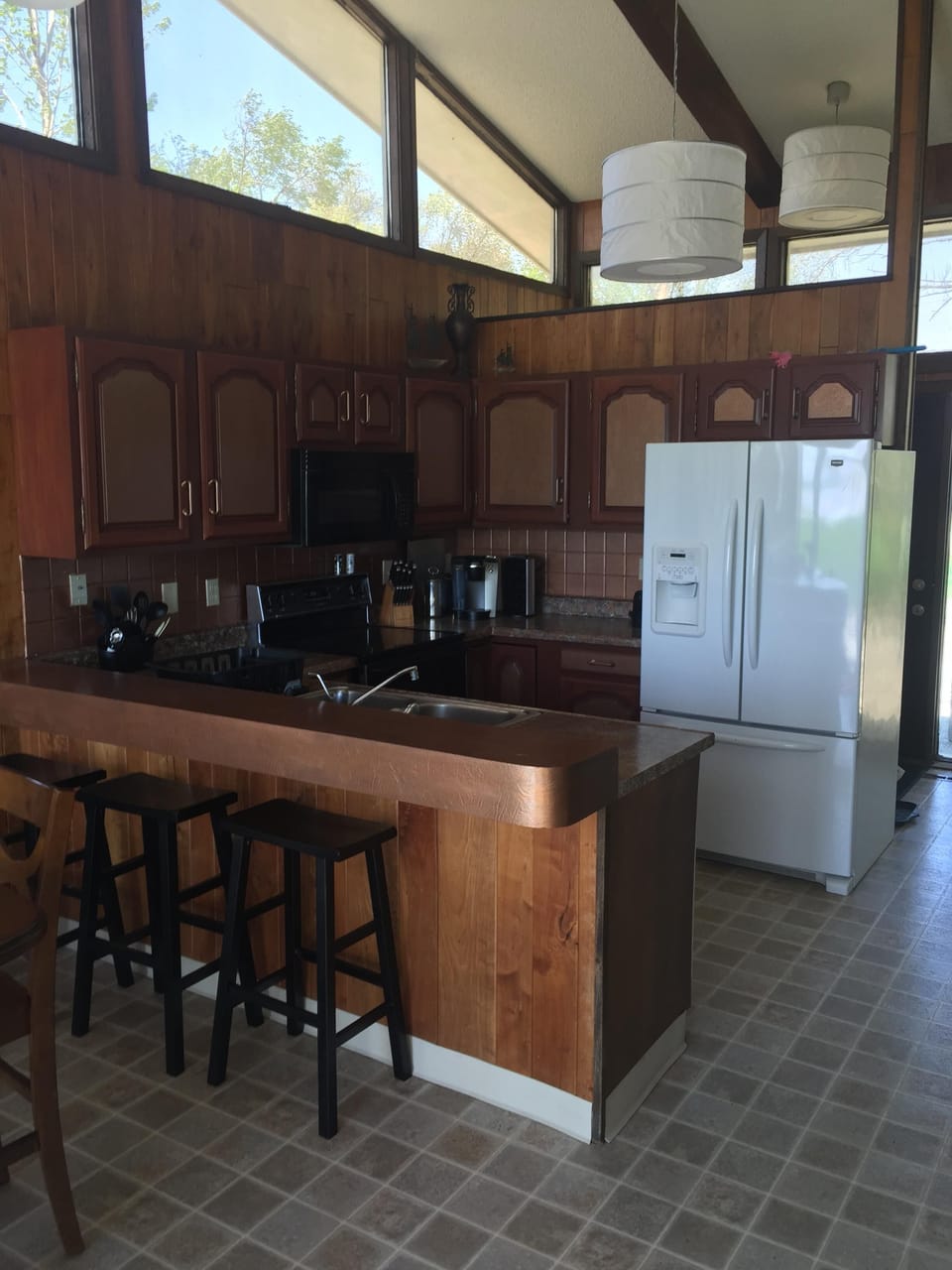 Kitchen area with bar seating