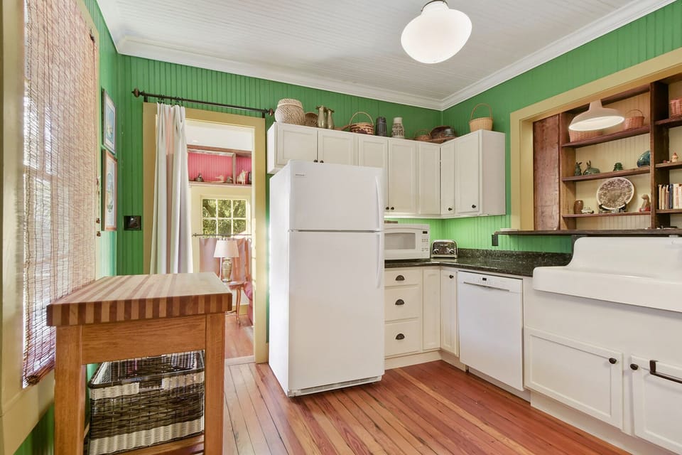 Kitchen with updated appliances and heavy wood island. 