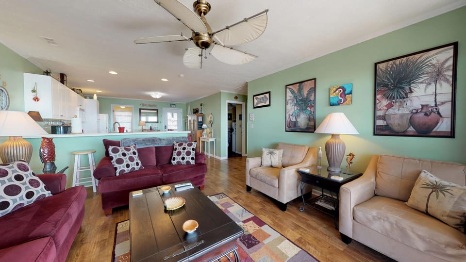 Living room and counter with 4 bar stools