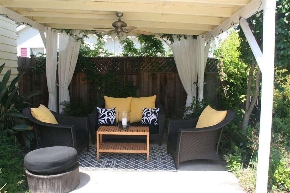 Covered outdoor living with ceiling fan and ambient lighting