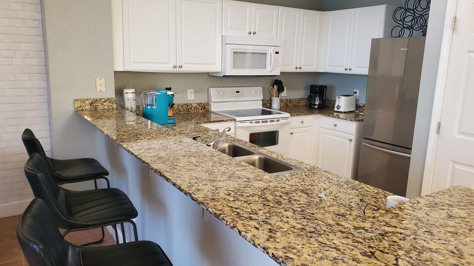 Full Kitchen with Brand New Microwave, Refrigerator, Stove, Keurig Coffee Maker.