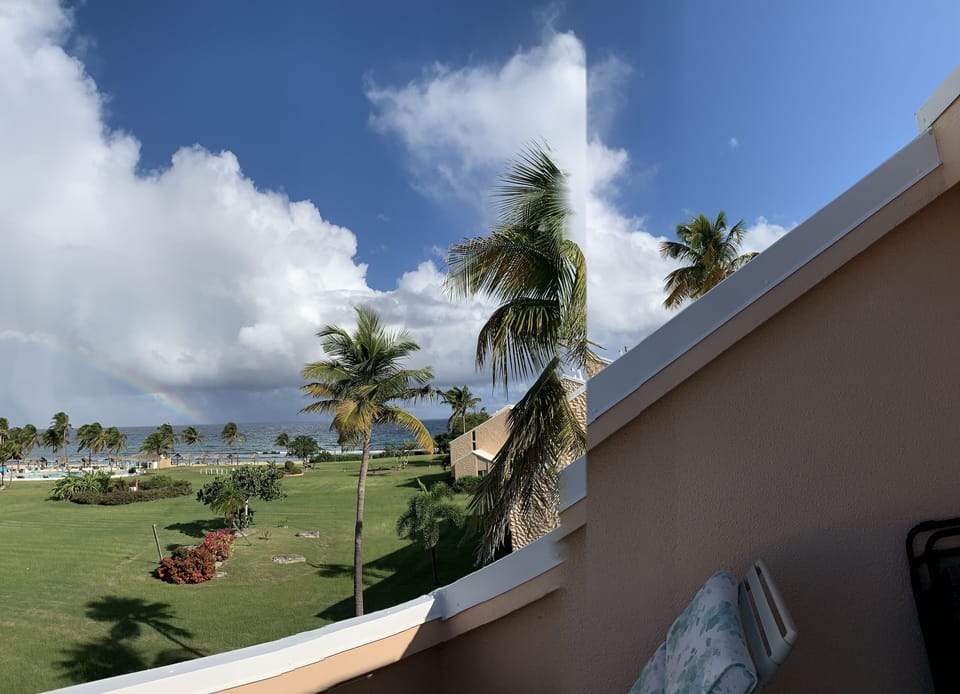 deck overlooking the condo complex and the beach