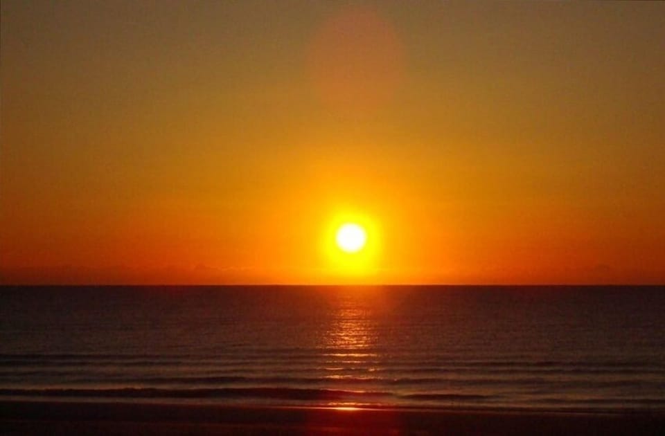Sunrise from the beachside deck. Both decks are partially covered for shade