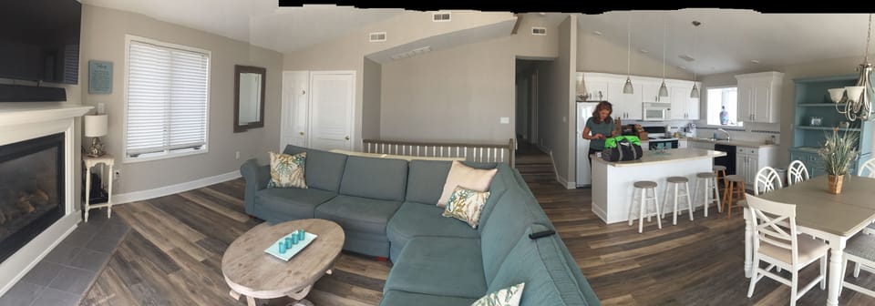 Panoramic of renovated flooring, kitchen and family room