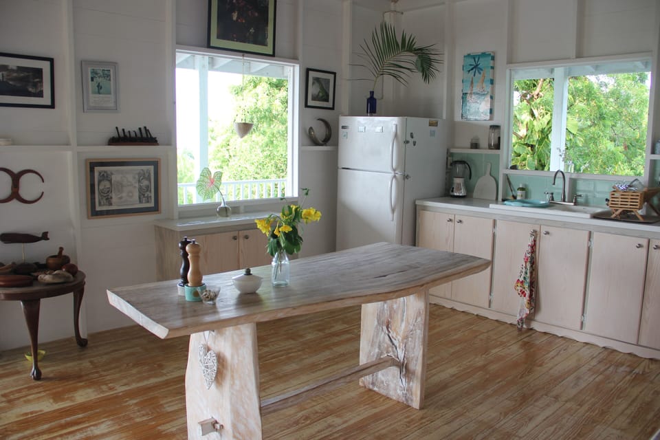 Custom-built kitchen, Corian counter tops & Bali dining table