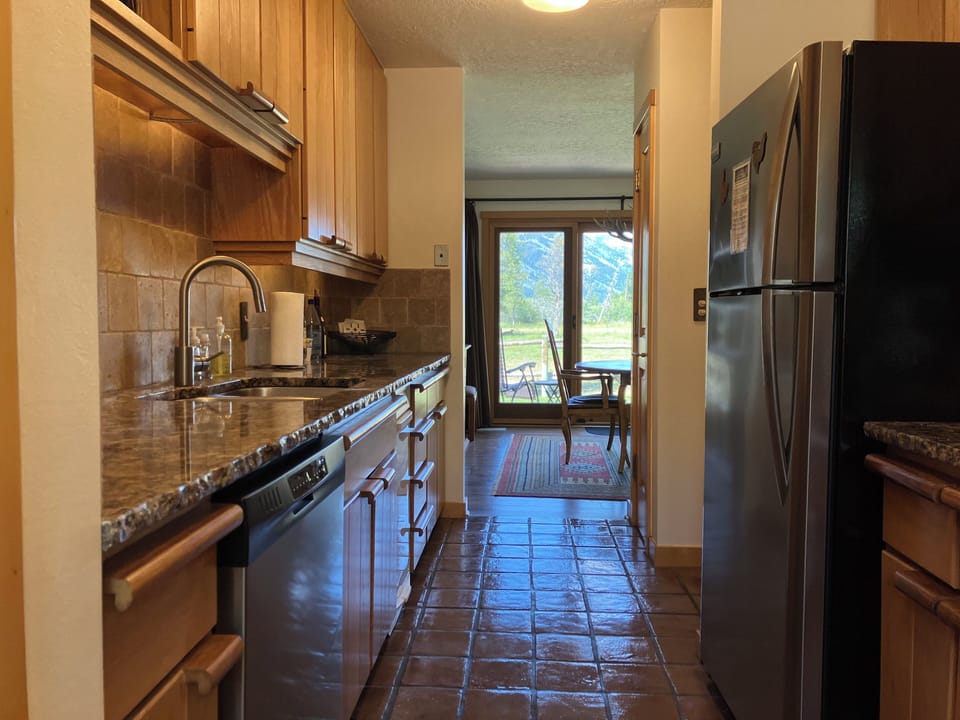 Fully equipped kitchen with dining room beyond