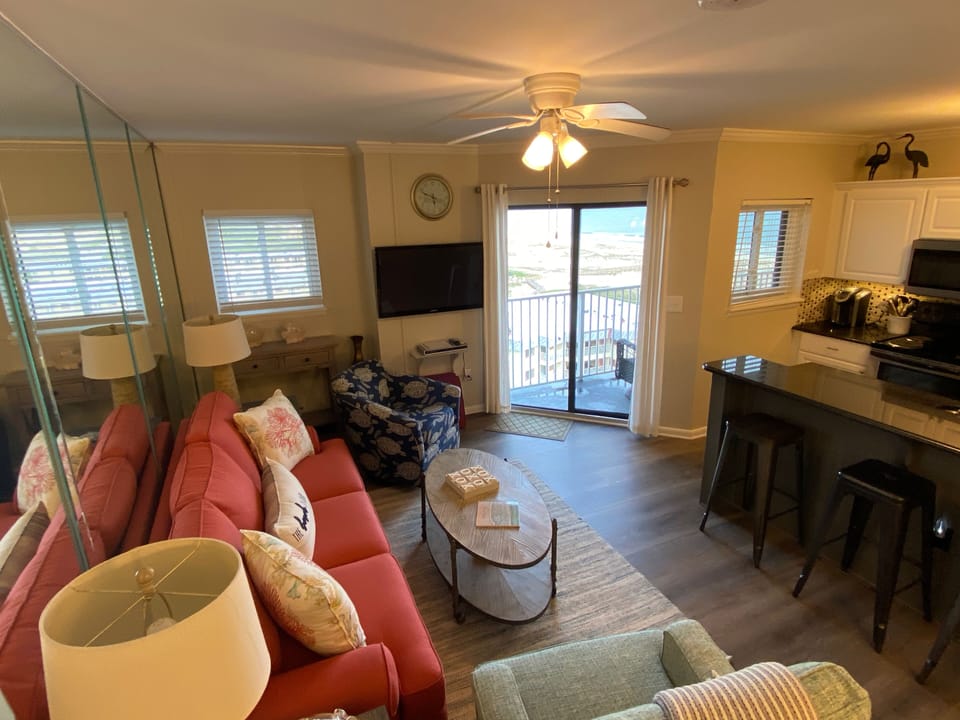 Spacious living area with sliding glass door leading out to the balcony.