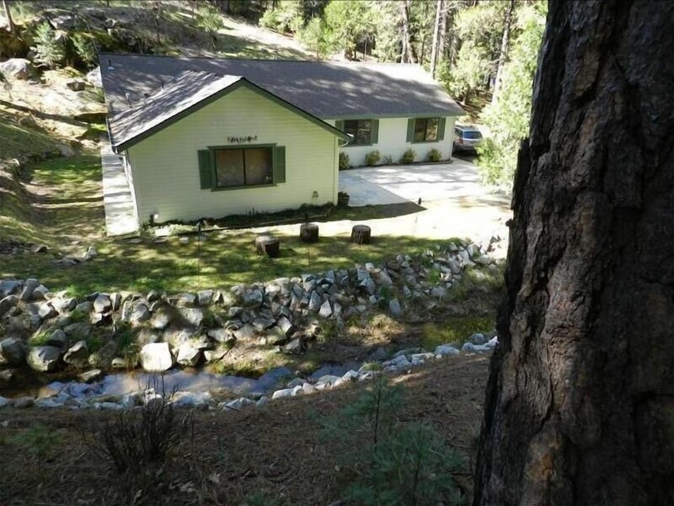 View of the creek from one of the seating areas on the property.