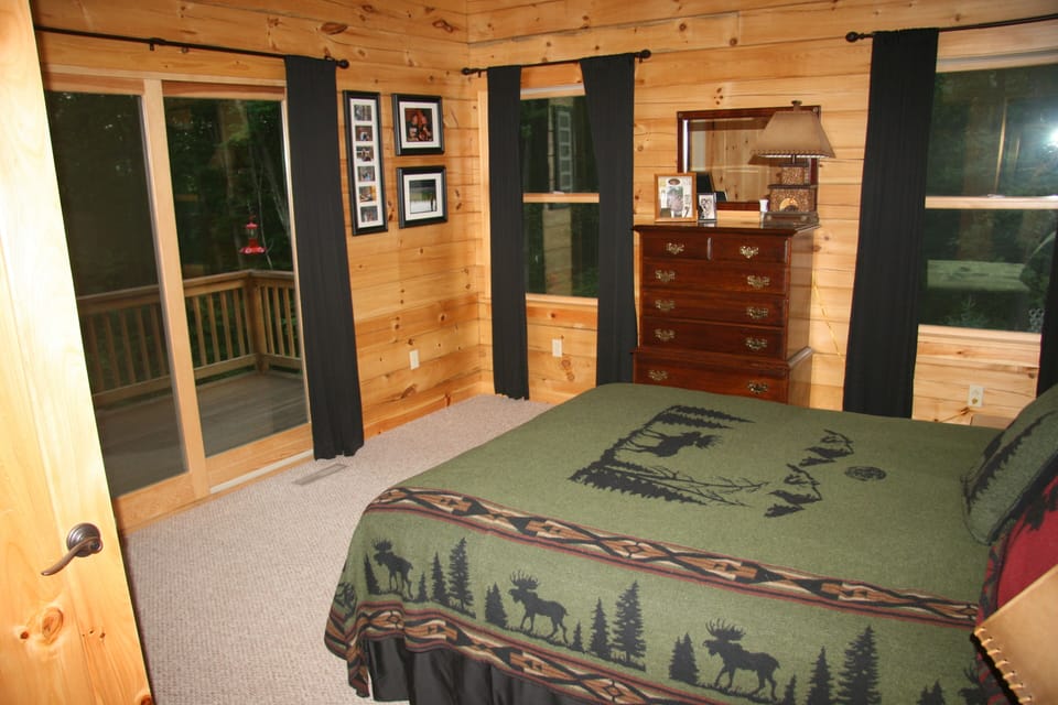Queen bedroom with walk-out and direct access to bath with jetted tub