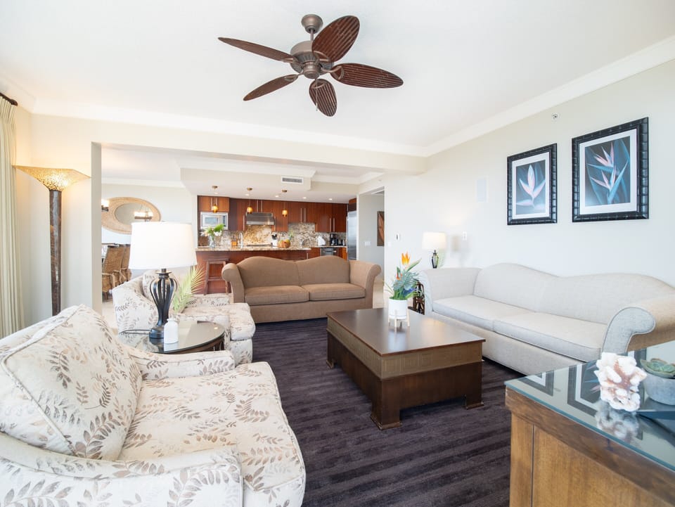 Comfortable open-concept living space with direct access to the dining area and gourmet kitchen, perfect for family gatherings.