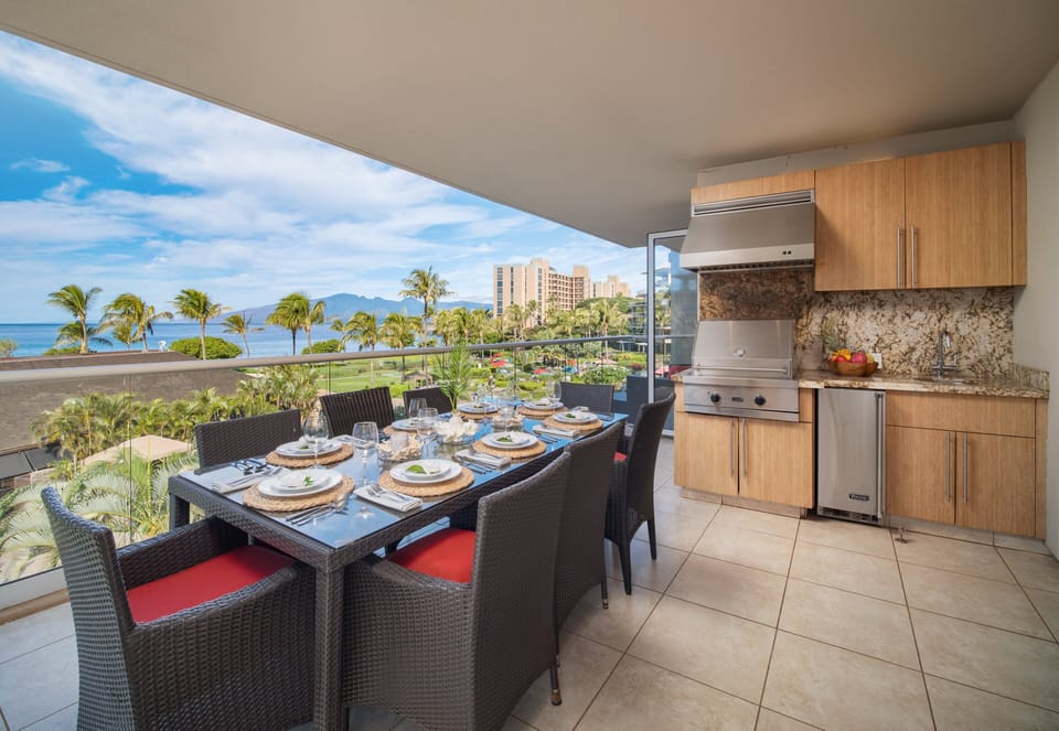 Enjoy outdoor dining on your lanai featuring a fully equipped kitchen and breathtaking ocean views, perfect for family meals or romantic evenings.