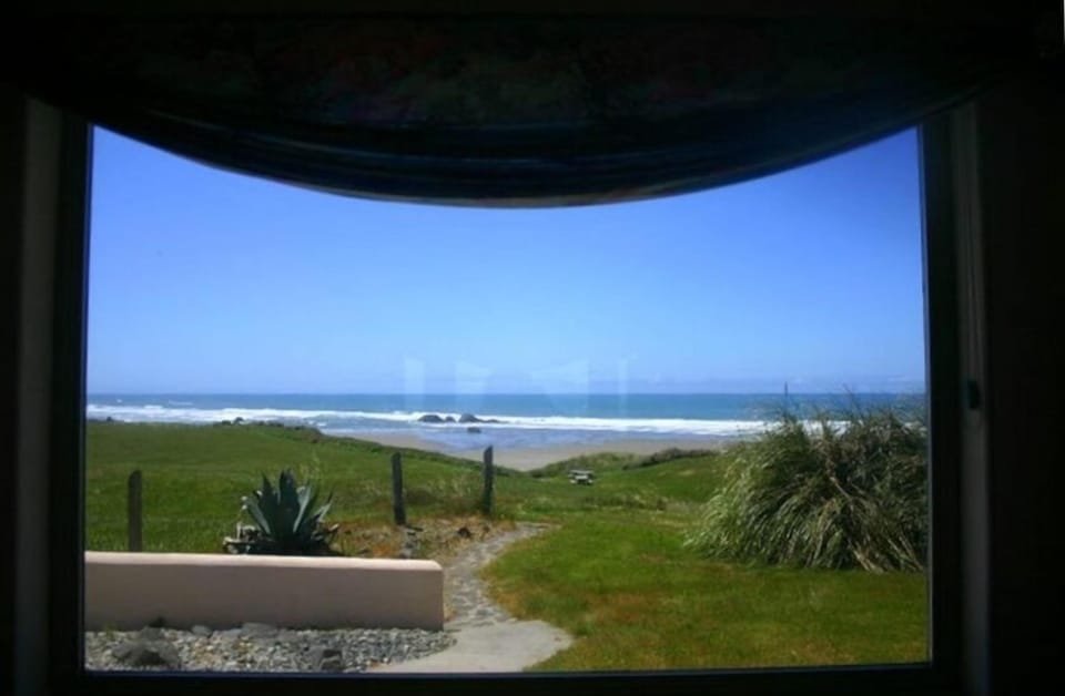 Beach view from Dining Room showing path to your beach with NO STEPS!