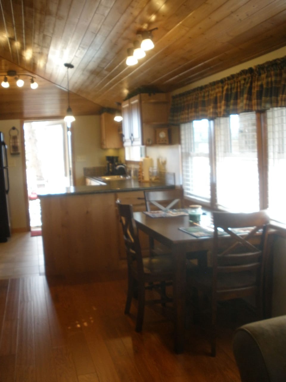 The dining area offers views of the outdoors as well as a nice view to the TV!