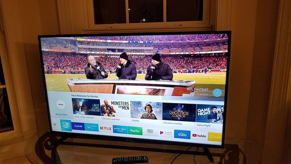 living area Big Samsung Smart TV, over 100 channels or stream your own.