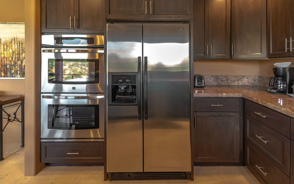 Eagle's Nest Suite #8 kitchen has full-size stainless steel appliances.