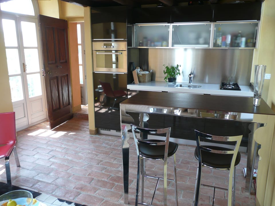 Efficient little kitchen with oven, microwave, dishwasher, 2 burner cooktop.
