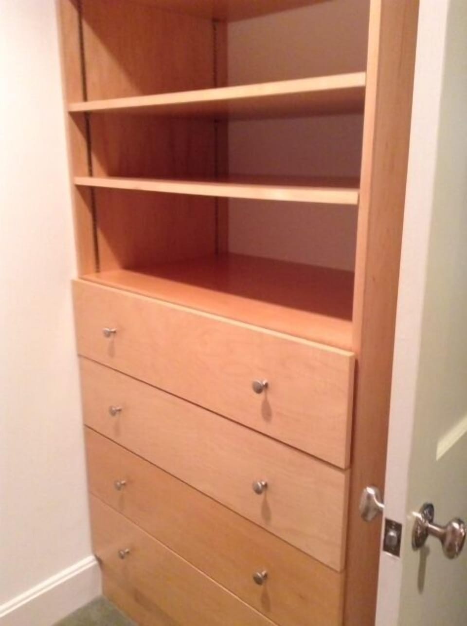 Built-ins in large first floor primary suite closet
