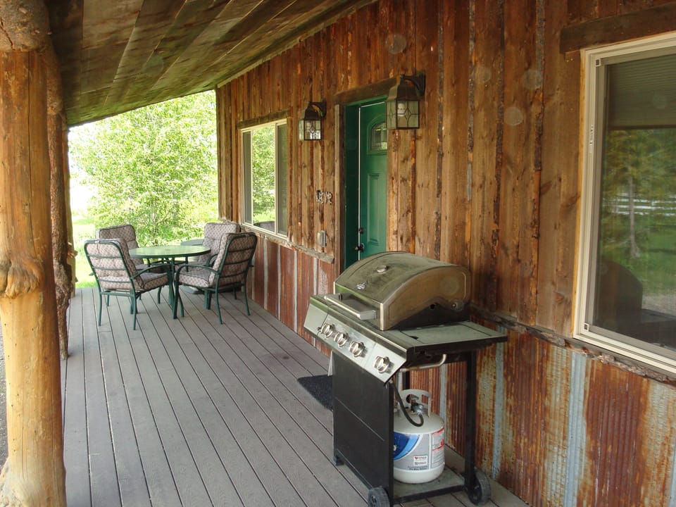 Time to relax on Creekside Cabin's porch while grilling out & admiring the view!
