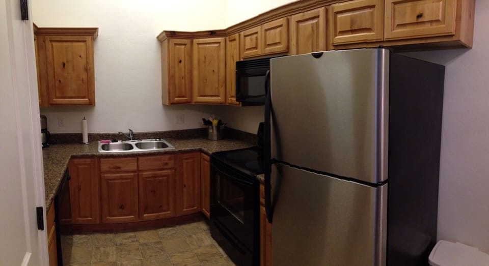full kitchen well stocked with all appliances