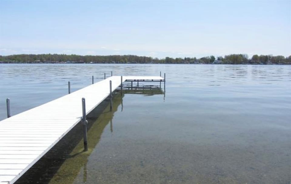 deck with shallow sandy beach and large section for fishing and boat docking