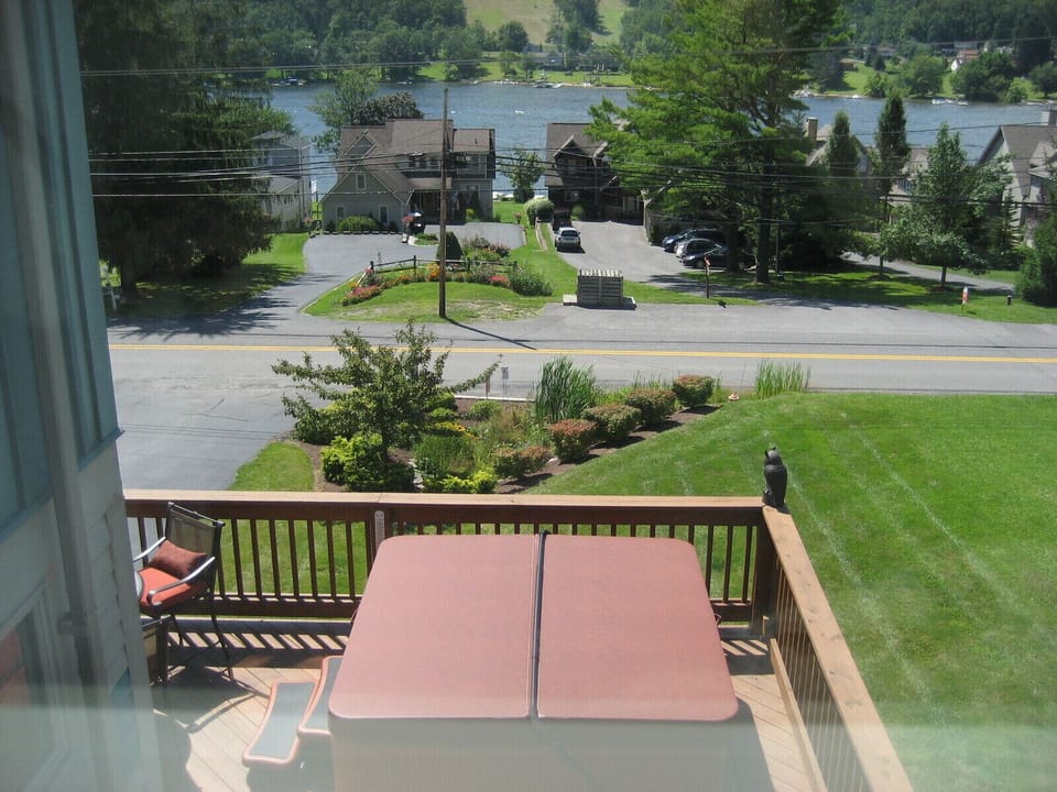 View of lake, mountain and hot tub from 2nd floor bedroom