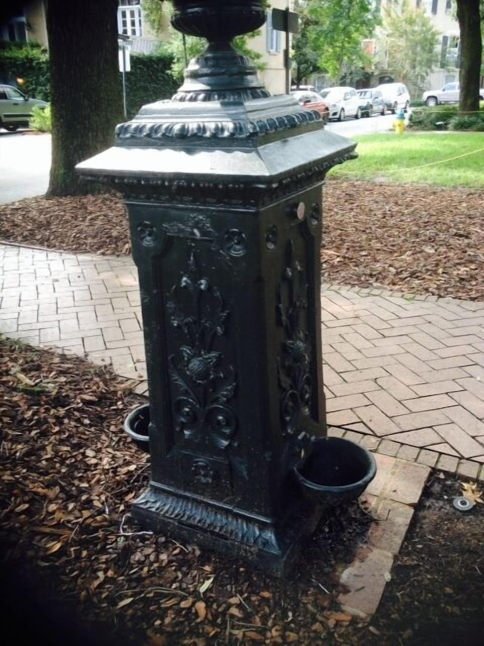 historic dog fountain in square