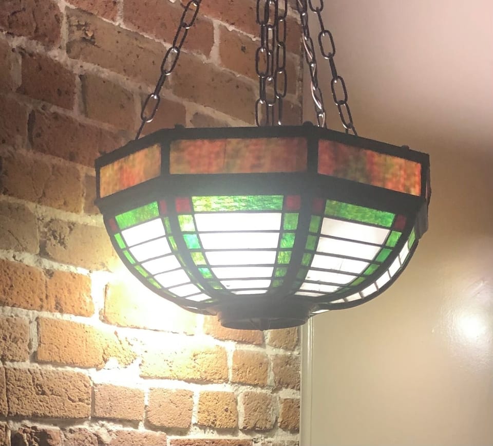 Antique chandelier over wet bar
