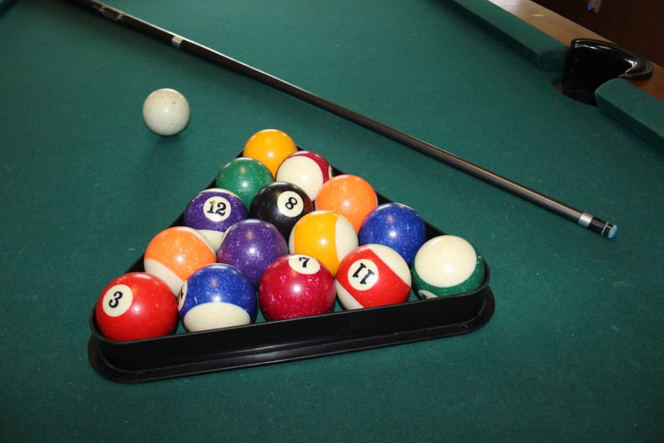 Pool table for hours of fun and friendly competition.
